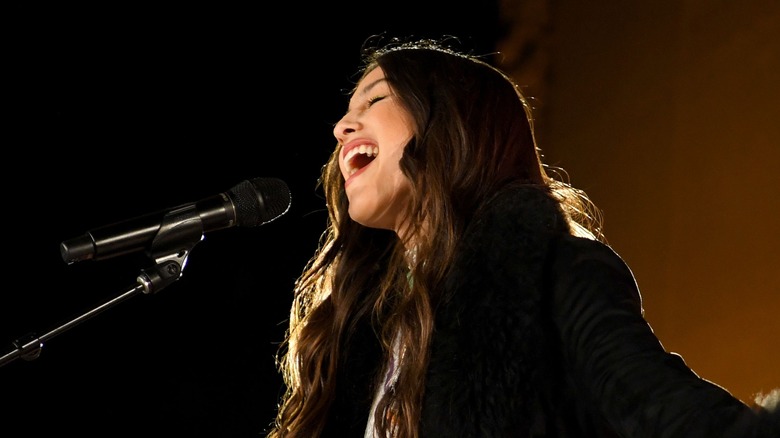 Olivia Rodrigo performing at the Teen Vogue Summit