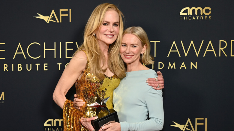 Nicole Kidman hugging Naomi Watts with AFI award in her hand