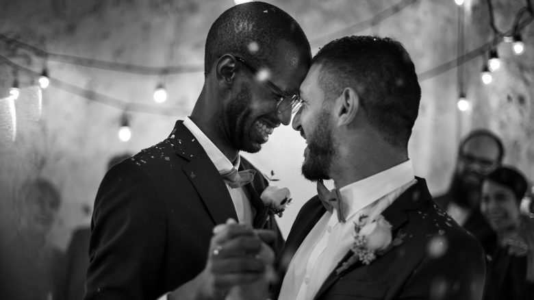 Male couple enjoying their wedding