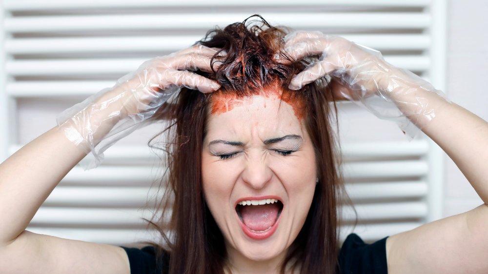 Woman dyeing her own hair 