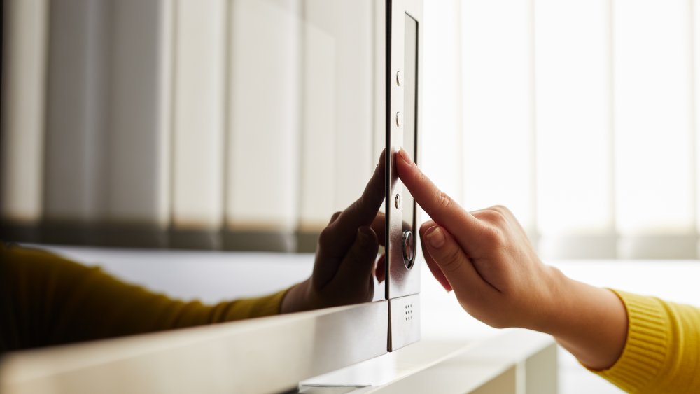 woman using microwave