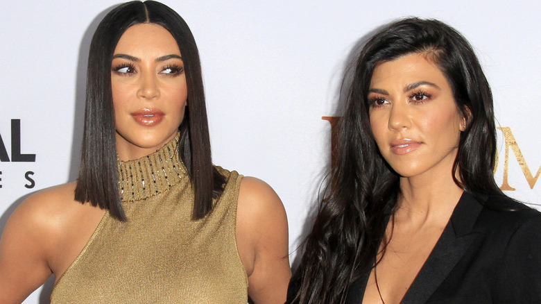 Kim and Kourtney Kardashian on red carpet