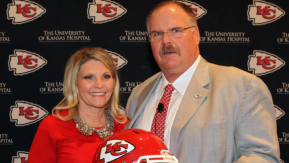 Andy and Tammy Reid hold helmet