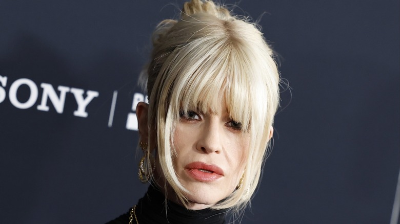 Kelly Osbourne posing