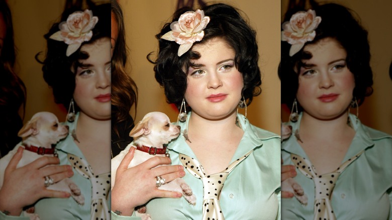 Kelly Osbourne posing with her dog