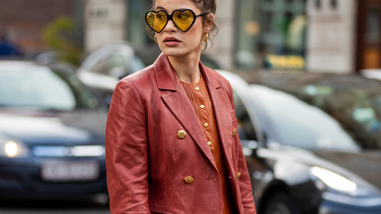 Woman in an orange blazer