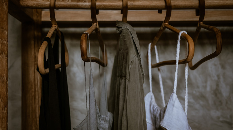 Rustic hangers with clothing