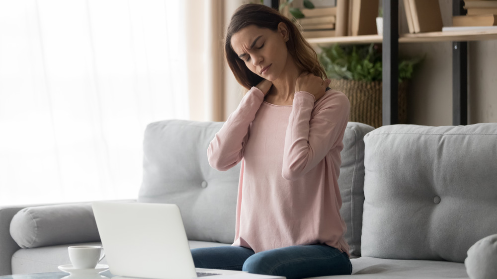 Woman sitting in pain