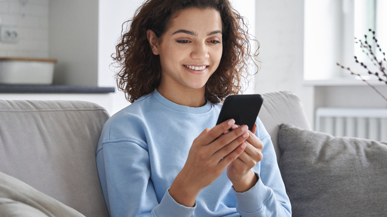 Young woman using her smartphone 