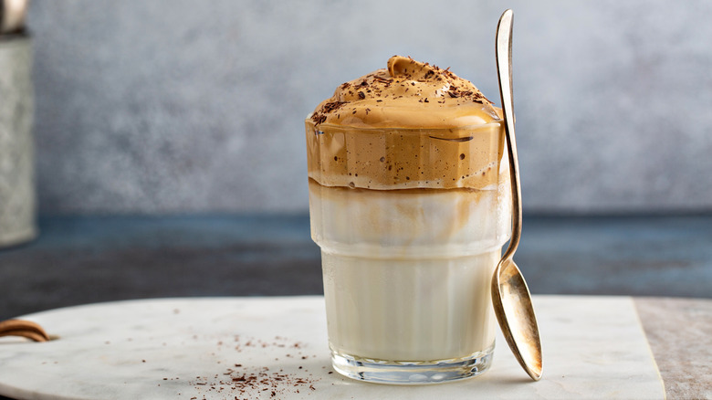 A cup of whipped coffee over milk