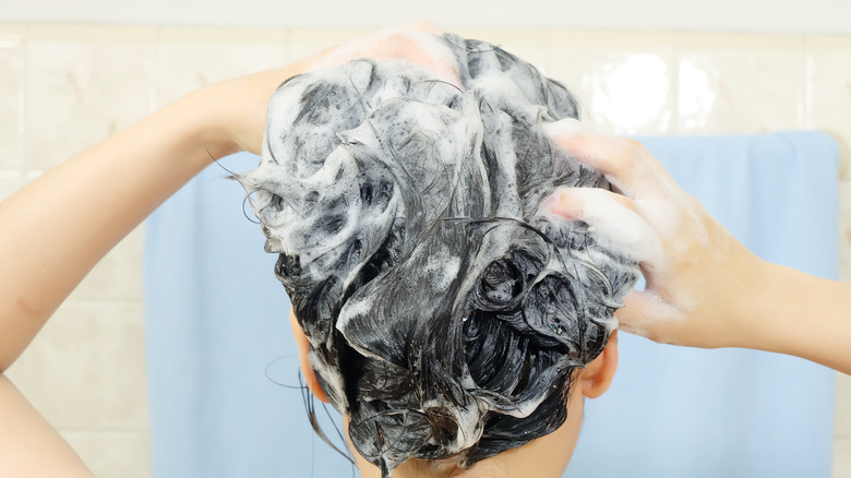 Woman shampooing her hair