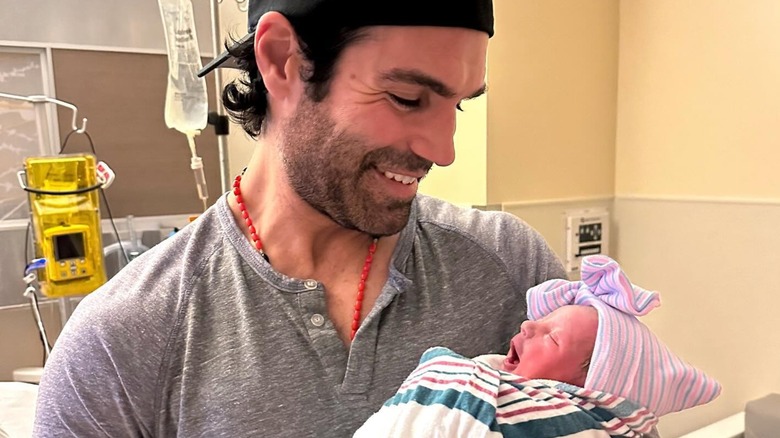 Jordi Vilasuso smiling, holding Lucy Vilasuso