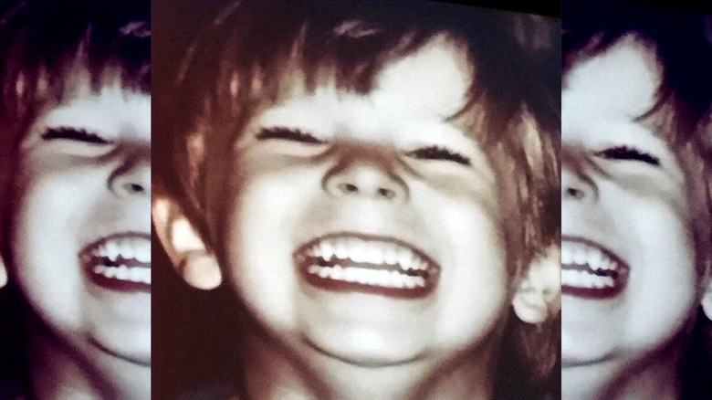 Billy Miller as a child smiling
