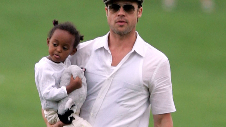 Brad Pitt carrying his two-year old daughter Zahara Jolie-Pitt