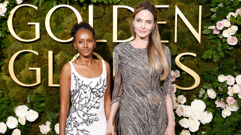 Zahara and Angelina Jolie holding hands