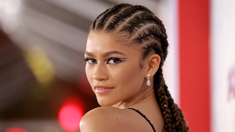 Zendaya posing looking over shoulder