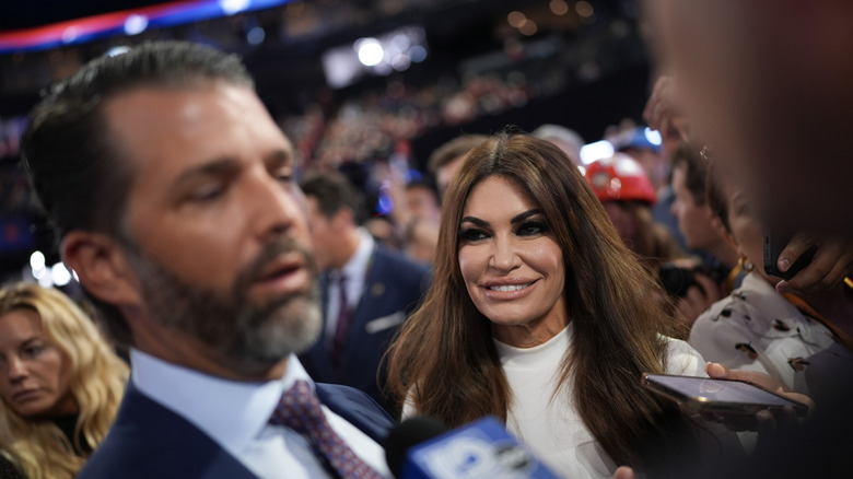 Kimberly Guilfoyle grinning at Donald Trump Jr.