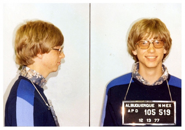 Side profile of young Bill Gates next to portrait photo of young Bill Gates with a mugshot sign hanging from his neck