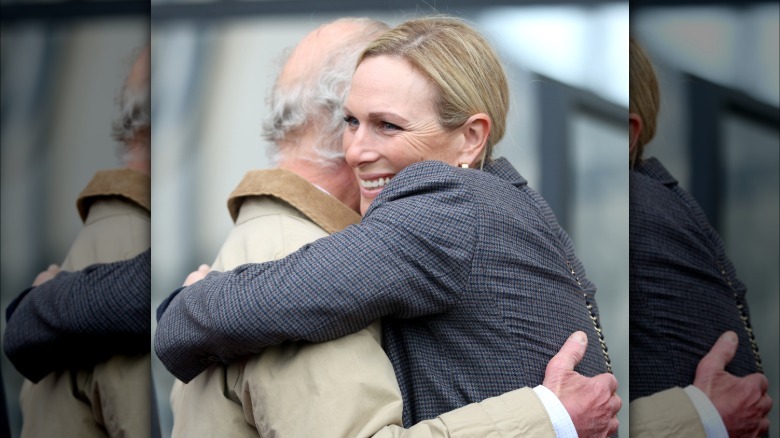 King Charles III and Zara Tindall hugging