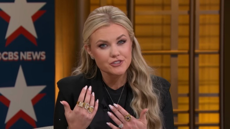 Erika Kirk wearing five large rings