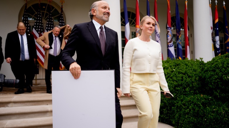 Karoline Leavitt smiling and walking