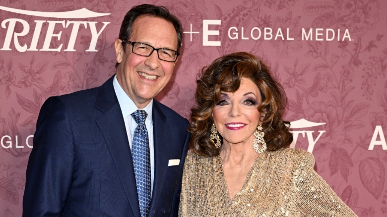 Percy Gibson and Joan Collins smiling together
