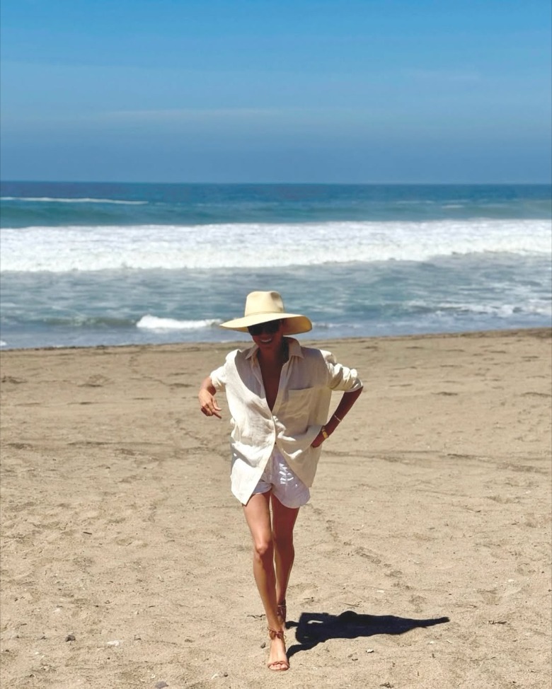 Meghan Markle walking on the beach towards the camera