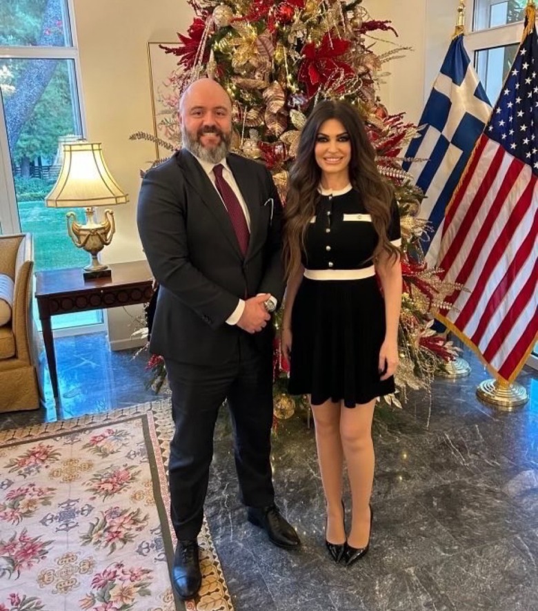 David Baker and Kimberly Guilfoyle pose together in front of a Christmas tree (2026)