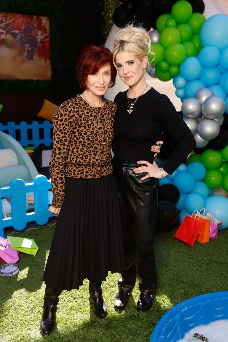 Sharon Osbourne with her arm around Kelly Osbourne