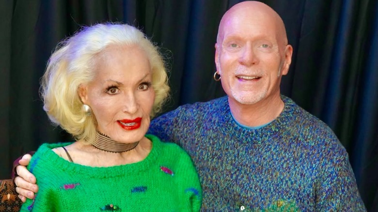 Sam Irvin with his arm around Julie Newmar