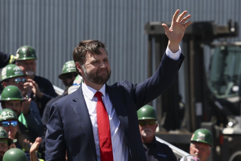 JD Vance waves at a crowd in Huger