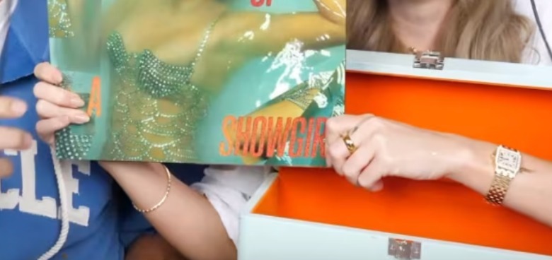 Close-up of Taylor Swift's jewelry on