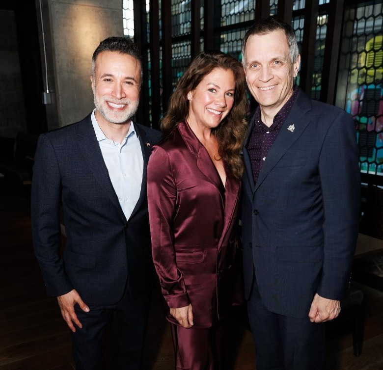 Sophie Grégoire posing for a photo with Mark Carney and another man