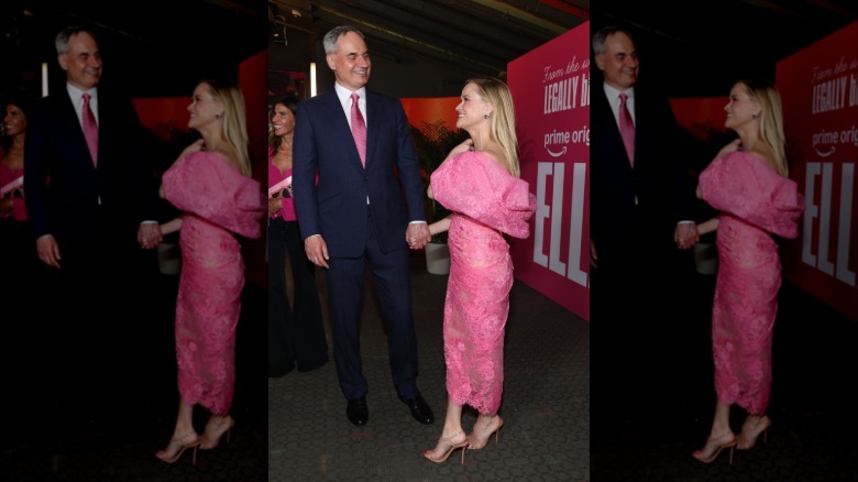 Oliver Haarmann and Reese Witherspoon hold hands at the