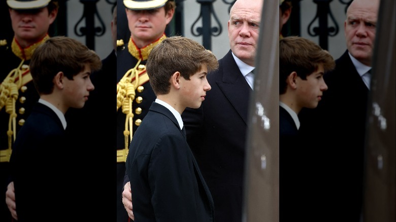 Mike Tindall comforting Viscount James Severn