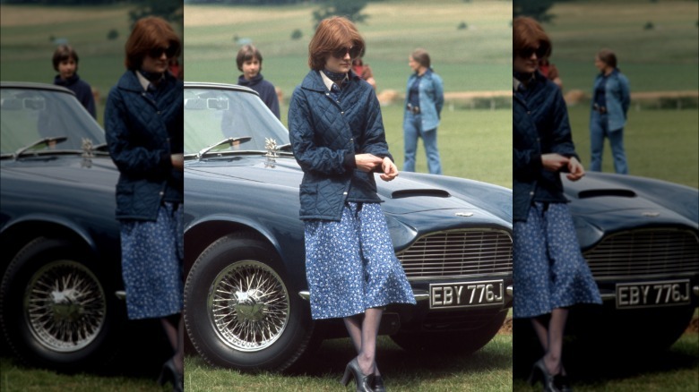 Lady Sarah Spencer leaning on a car