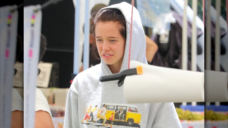 Shiloh Jolie with a piercing and a gray hoodie