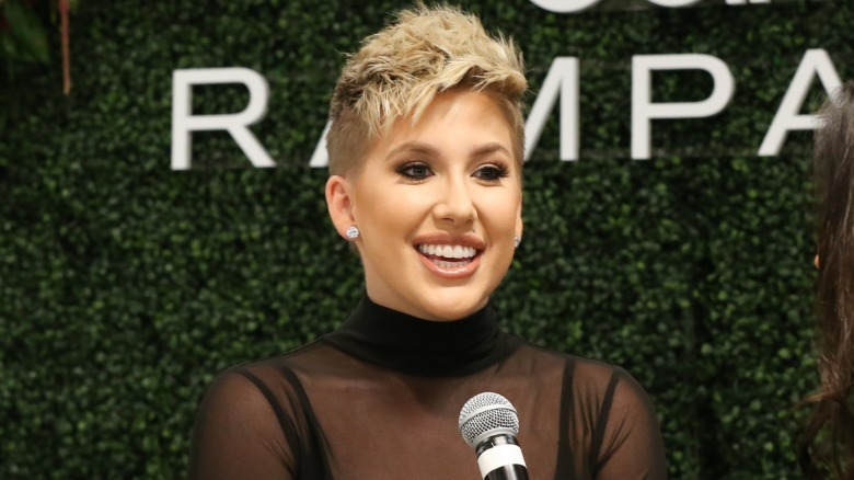 Savannah Chrisley smiling in front of microphone
