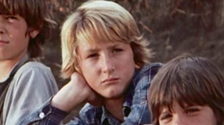 Sean Penn resting his head on his hand in a still from 'Little House on the Prairie'