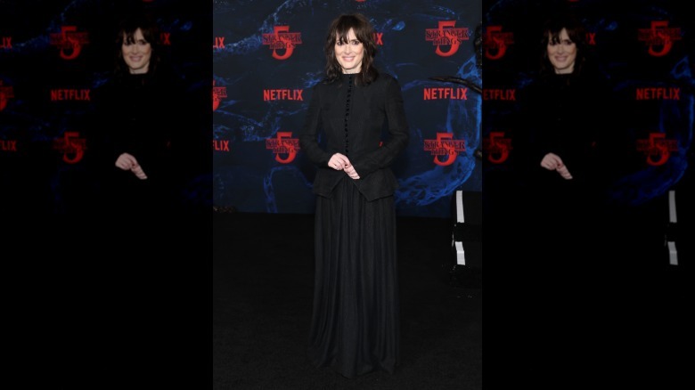 Winona Ryder smiling in all black