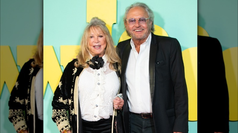 Pattie Boyd smiling next to her husband Rod Weston