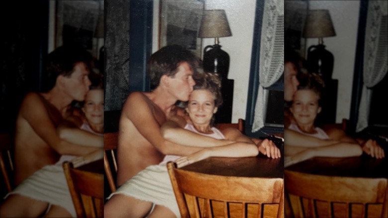 Kevin Bacon kissing Kyra Sedgwick on the head