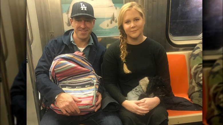 Amy Schumer and Chris Fischer in subway car