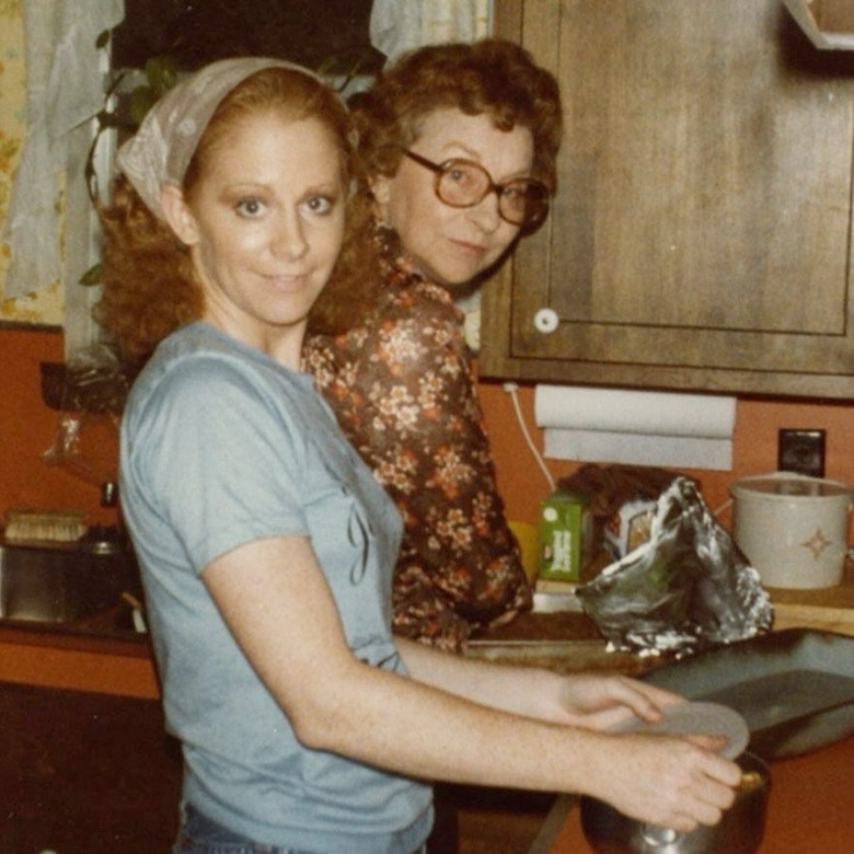 Younger Reba McEntire in the kitchen with her mother