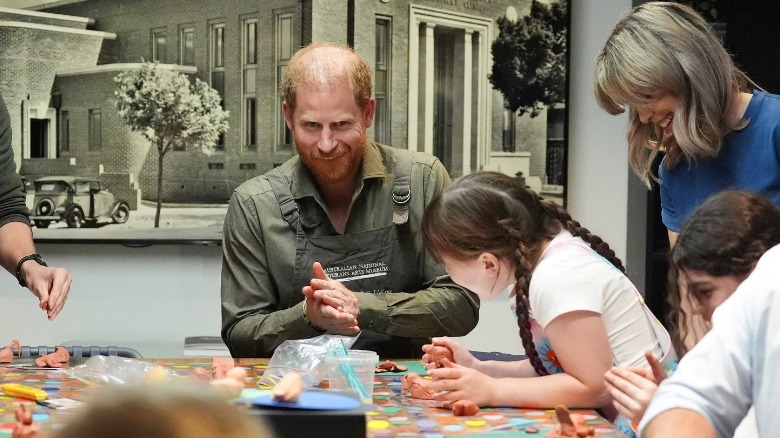 Britain's Prince Harry (C)